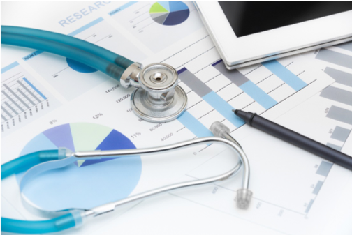 Stethoscope laid on top of papers.